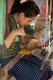 Laos: A young weaver in a village near Luang Prabang